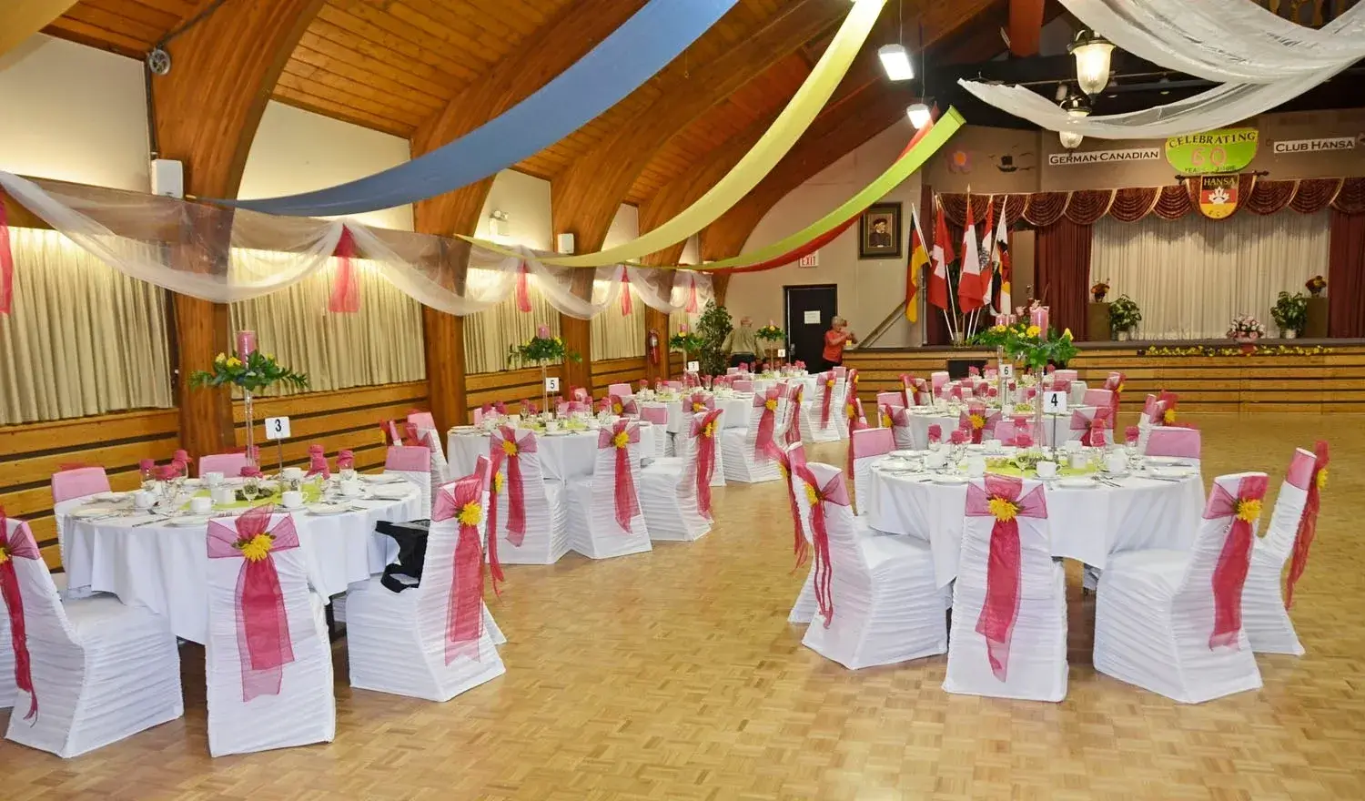 A banquet hall with many tables and chairs