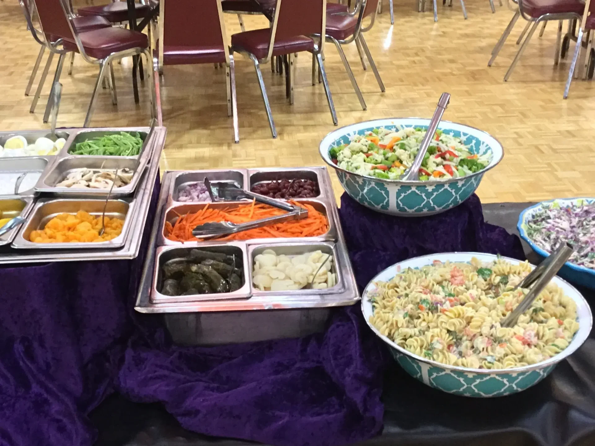 A table with several different bowls of food.